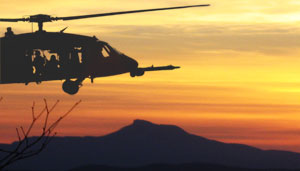 Black Hawk Helicopter with Camel's Hump in the background.
